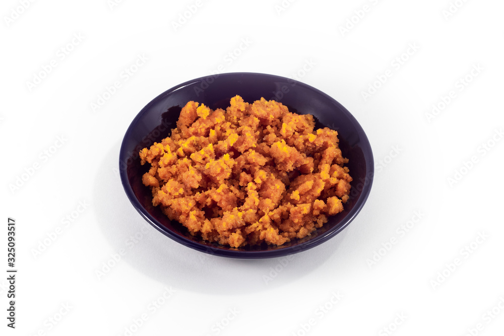 Fried granular caviar of freshwater fish ( crucian carp) in a plate on a white background Fried granular caviar of freshwater fish ( crucian carp) in a plate on a white background