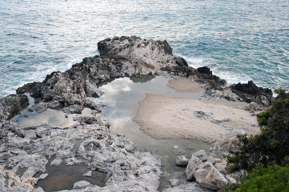 An amazing rock spike along the coastline. Marina di Camerota, Italy