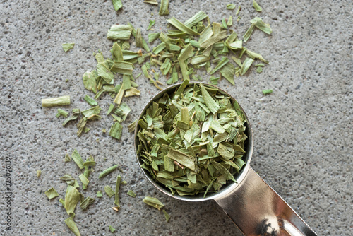 Dried Tarragon Spilled from a Teaspoon photo