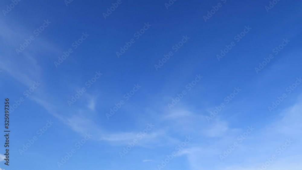 Slowly moving white cirrus cloud turn to angel & wing formation in horizon on tropical summer or spring bright blue wispy sky at sunny day morning sunlight, beautiful relaxing cloudscape TimeLapse 