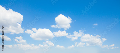 Fluffy Clouds In Blue Sky. Background From Clouds. © artmim