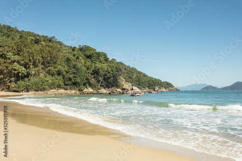 Beautiful view of Parnaioca beach in Ilha Grande, a tropical beach visited on a boat trip on the south coast of Rio de Janeiro, on the coast of Brazil during a sunny day of holidays and sightseeing.