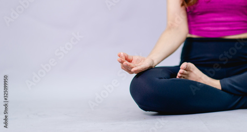 Women doing yoga for health Exercise in the room Concept of health care and good shape
