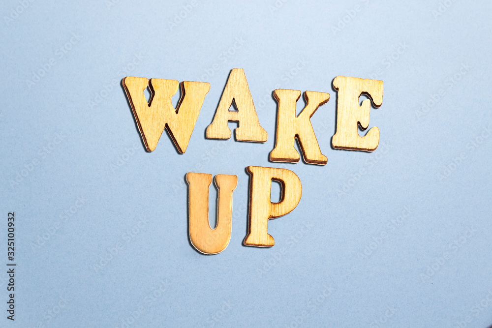forming wake up words with wooden letters forming wake up words with wooden letters