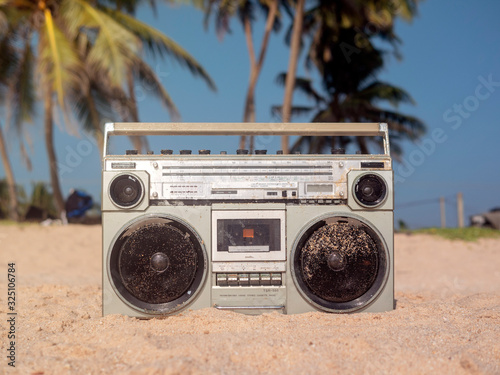 Quadro su tela Tape recorder in sea foam and waves.