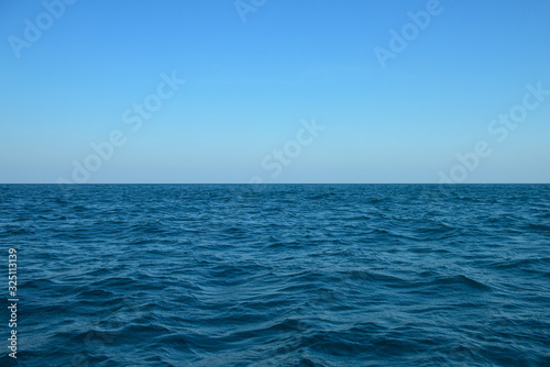 Beautiful blue sea on sky background