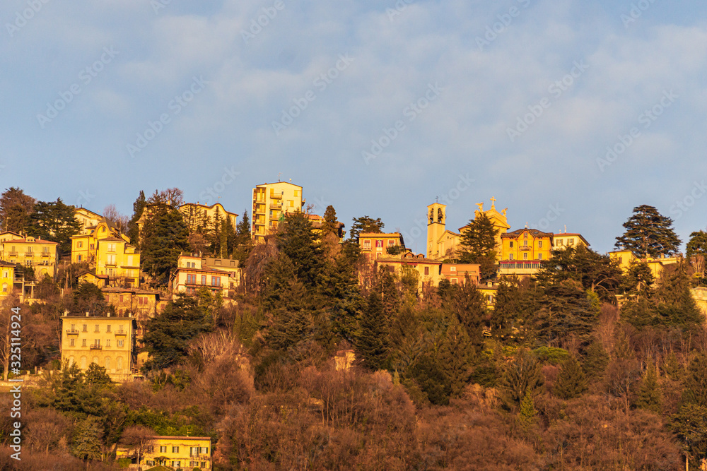 The town of Brunate (Italy), near Lake Como, in the Italian Alps, during sunset - February 2020.