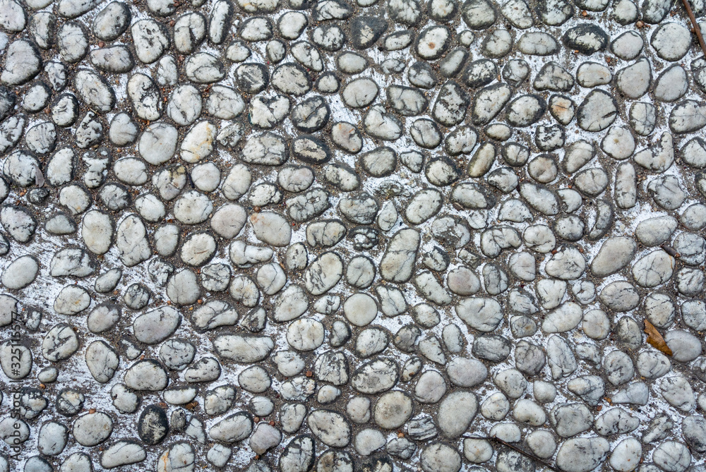 The wall surface of the building is made of cement and small gravel. The wall surface of the building is made of cement and small gravel.