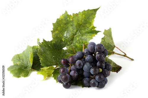 Wine grape and leaves isolated on white