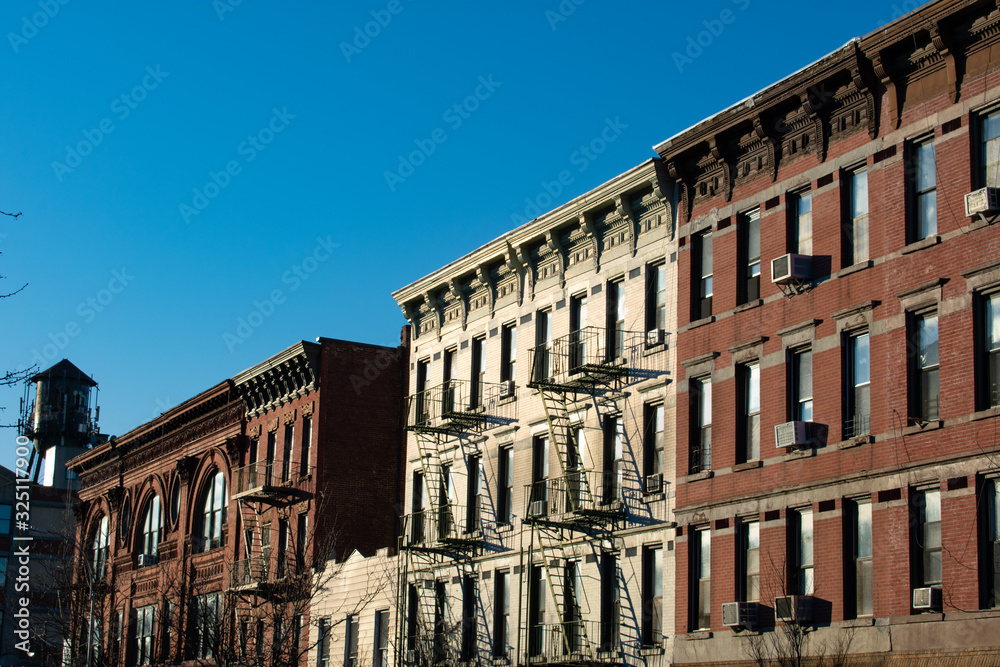 Row of Colorful Brick Buildings with a Water Tower in Greenpoint Brooklyn New York
