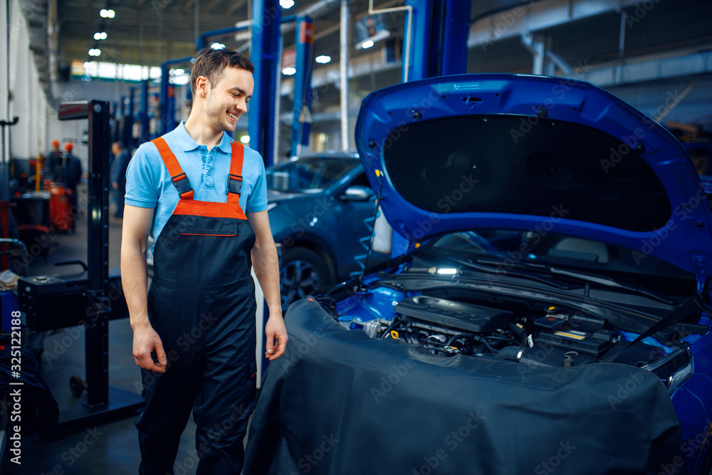 Repairman at vehicle with opened hood, car service Repairman at vehicle with opened hood, car service