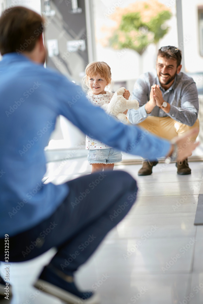 Gay mens having fun with child at shopping..Family at store. Gay mens having fun with child at shopping..Family at store.