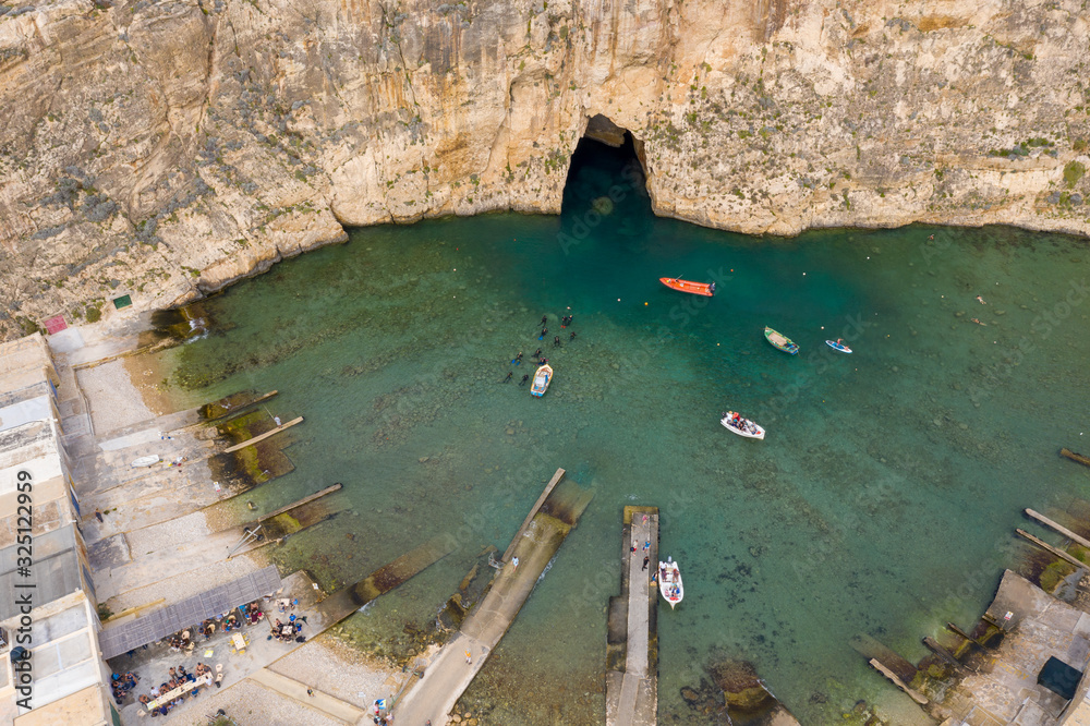 Aerial drone shot of the inland sea in Dwejra, Gozo