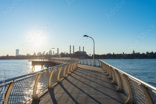 Fototapet Empty Pier at Transmitter Park in Greenpoint Brooklyn New York over the East Riv