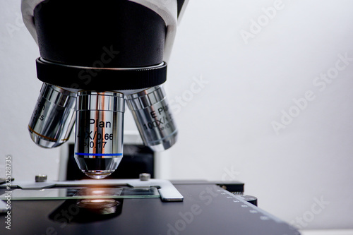 Cropped shot view of  the equipment and science experiments in Laboratory, Chemical substances for research and analyzing a sample under the microscope in laboratory. 