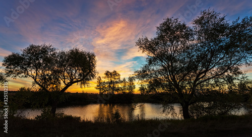 Fototapeta Naklejka Na Ścianę i Meble -  landscape of sunset with cloudy orange sky