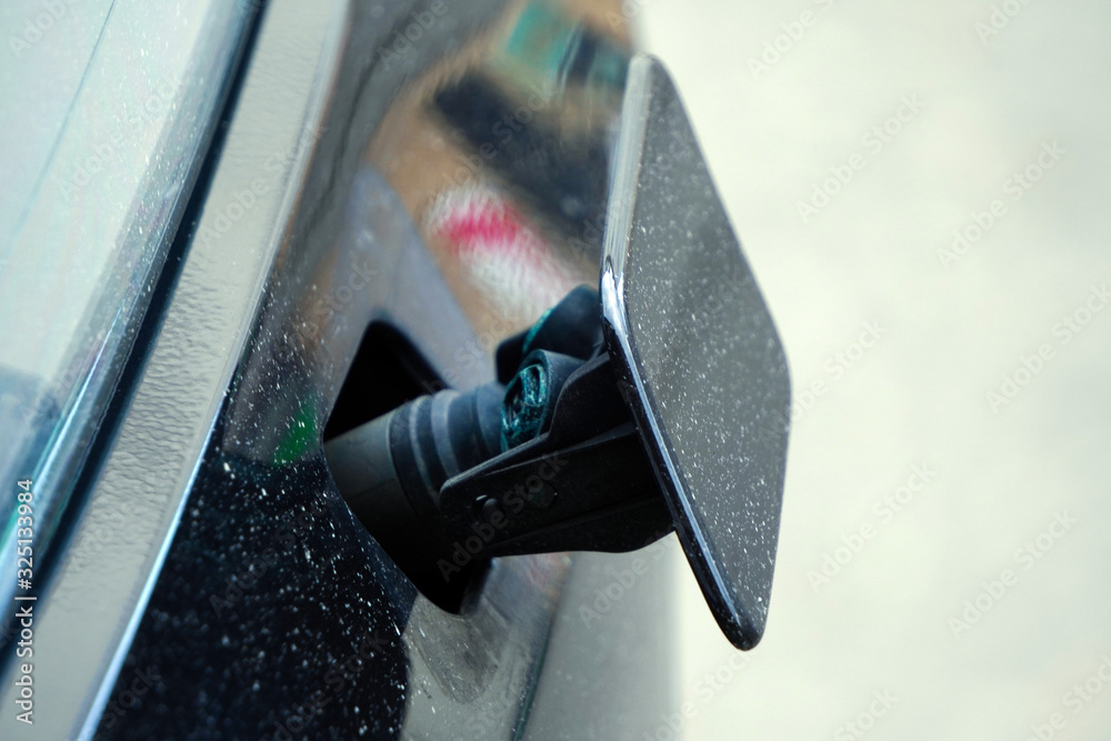 Headlight washer system of the black car. The headlight washer is