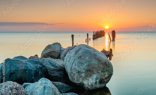 Remains of old broken fisheries pier, Baltic Sea, sunrise