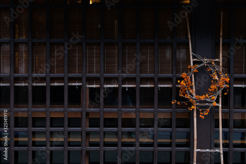 wooden wall of window and old house in Japan. low key and soft focus.