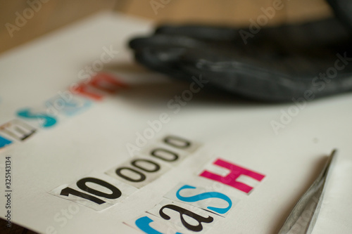 Kidnap ransom note in cut out letters demanding cash