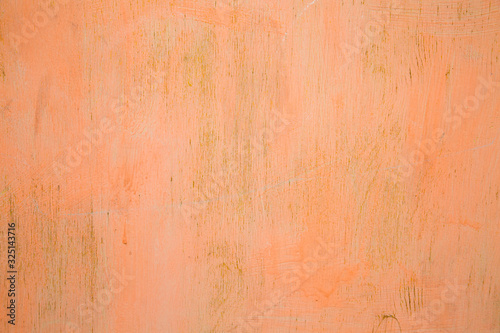 Background of old plywood painted pink with clear wood structure on a clear Sunny day, texture design.