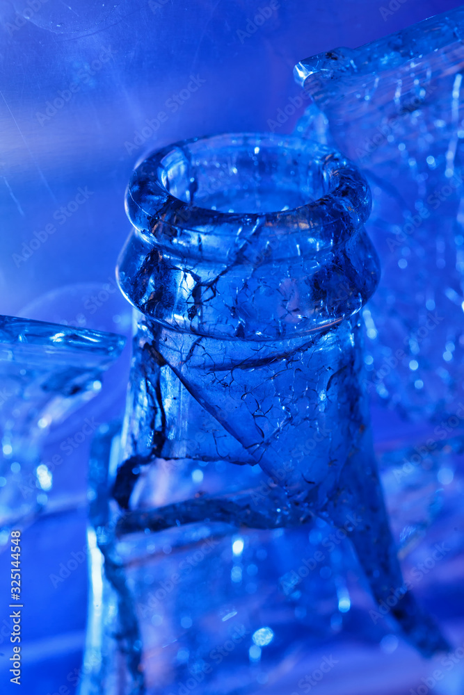 broken glass bottle in blue light broken glass bottle in blue light