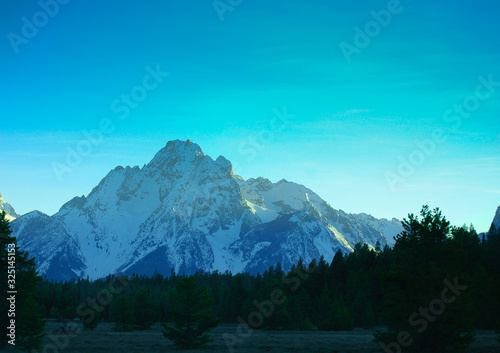 Snow Covered Mountain Against Blue Sky