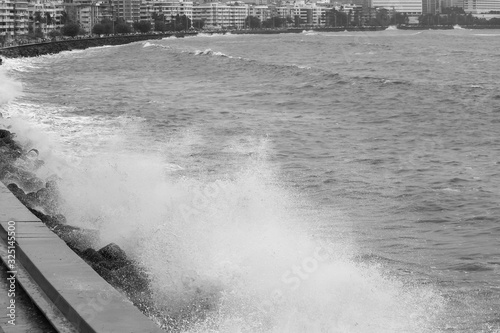 Waves crashing on a high tide day at Marine Drive, Mumbai, India