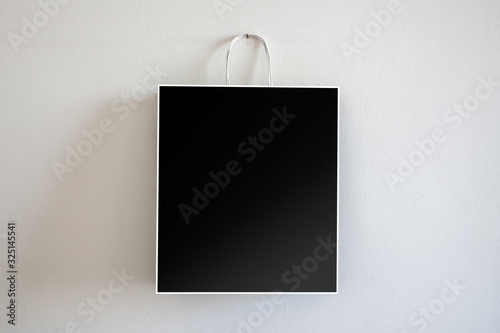 shopping tote bag hanging on wall background mock-up