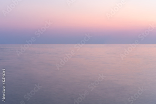 Sunset into the sea with twilight sky