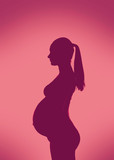 Silhouette of young pregnant woman profile