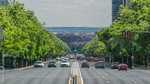 Paseo de la Castellana street traffic timelapse near Puerta De Europa towers as viewed from Plaza de Castilla, Madrid