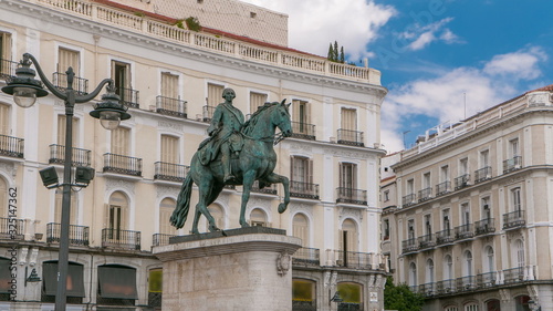 Statue of Charles III one of the famouse King of Spain timelapse hyperlapse on Puerta del Sol square in Madrid, Spain