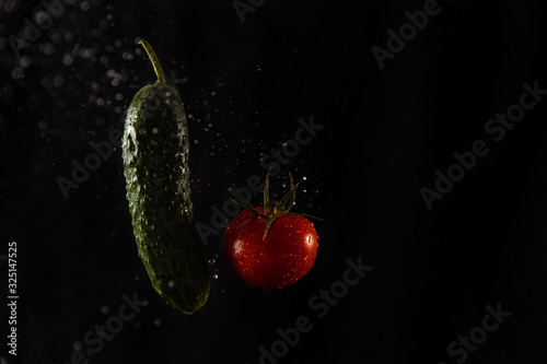 fresh green cucumber and tomato photo