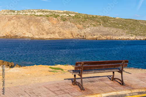 Bench with sea view on the north coast of Minorca. Balearic Islands, Spain