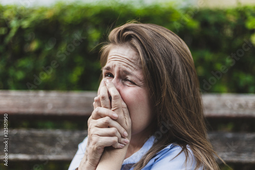 Close-up to a crying lonely woman