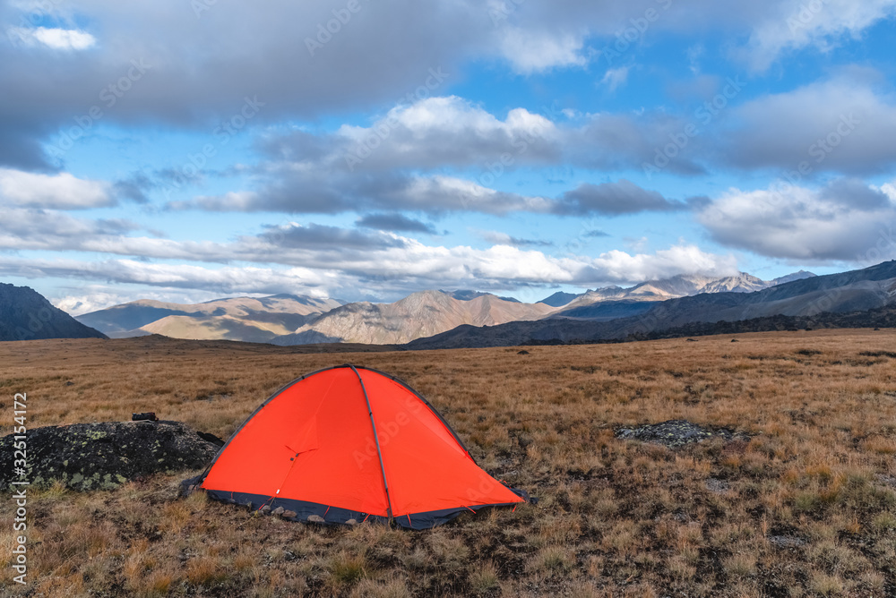 Beautiful landscape high in the mountains, with an established tent