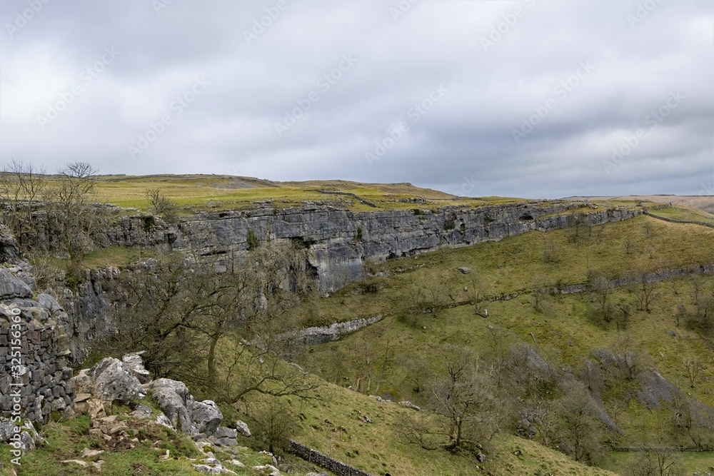 Winter view of Malham Cove, from a pastureland approach, in February, 2020