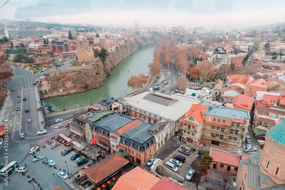 Tbilisi, Georgia, 15 December 2019 - aerial view of the old city from the cab of the funicular, shot through glass