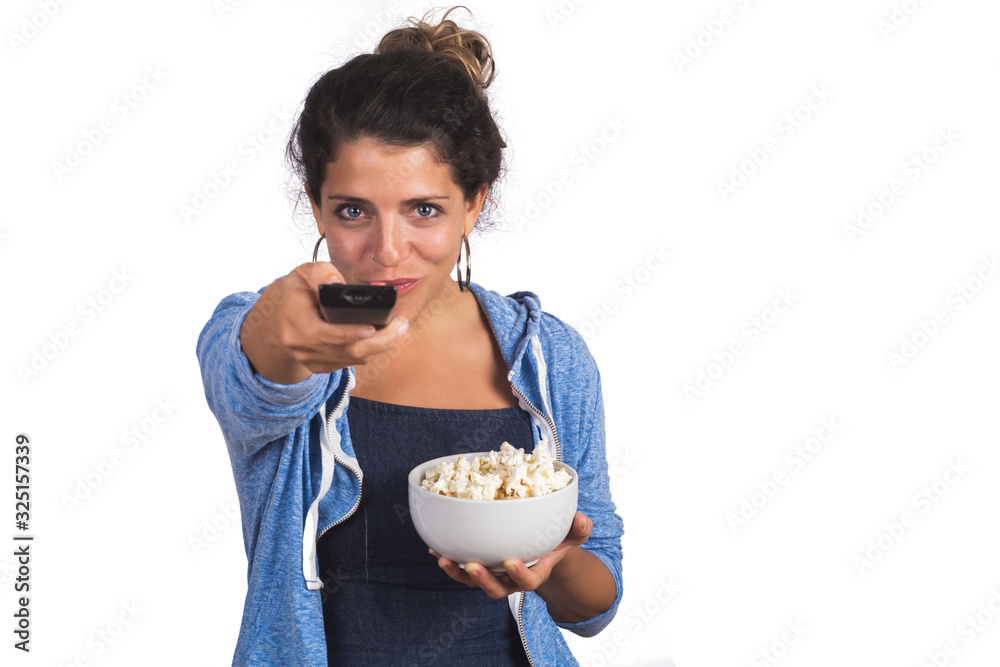 woman watching a movie while eating popcorn. woman watching a movie while eating popcorn.