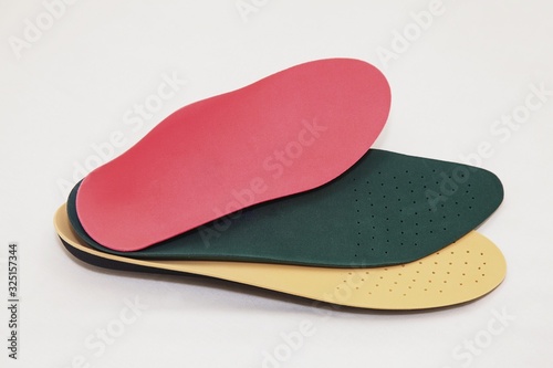 Orthopedic insoles for legs on a white background