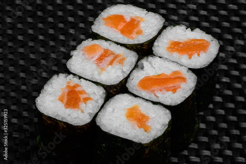 Japanese rolls on a dark textured background