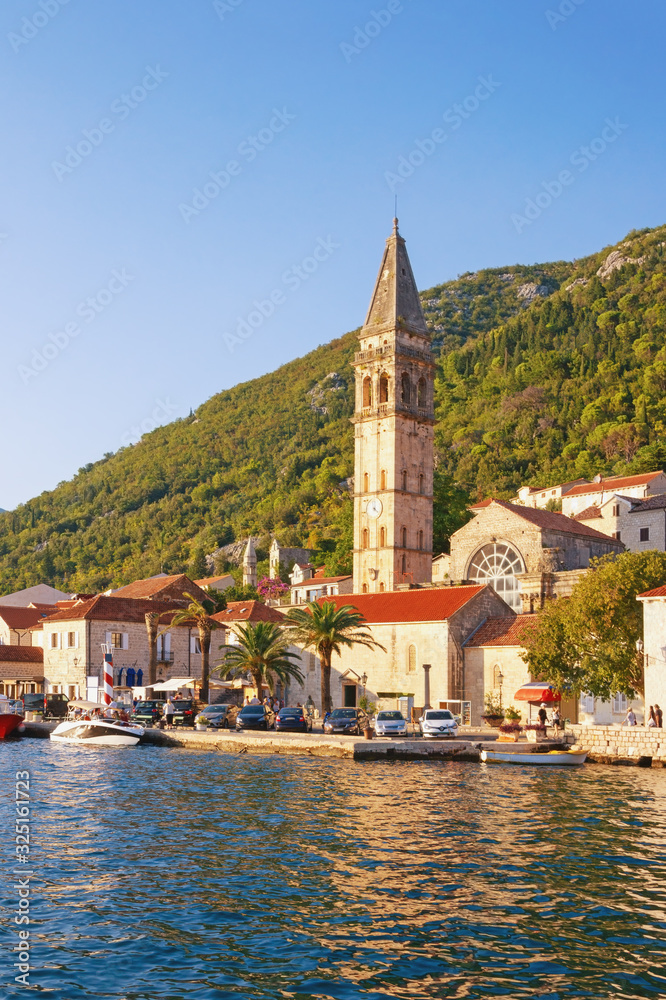 View of ancient town of Perast. Bell tower of church of St. Nicholas. Montenegro, Adriatic Sea, Bay of Kotor