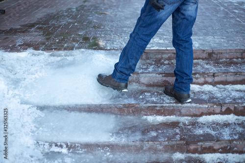 a man walks up the stairs with ice steps