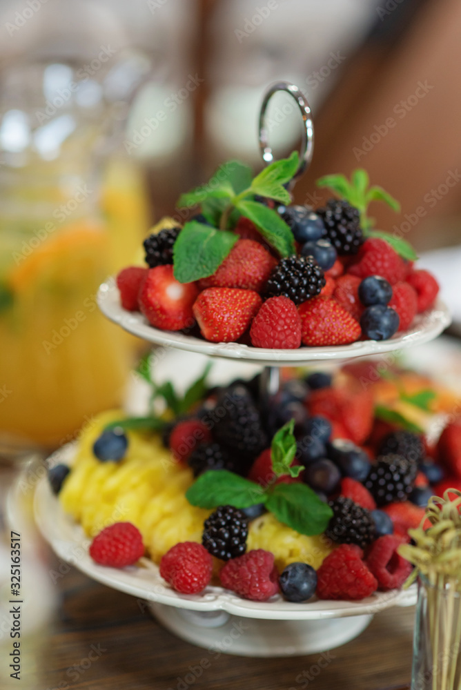 Raw fresh organic fruit and berries plate Raw fresh organic fruit and berries plate