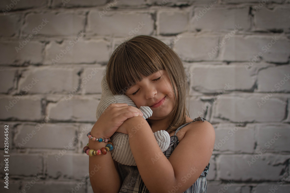 Small girl plays with stuffed animal Small girl plays with stuffed animal