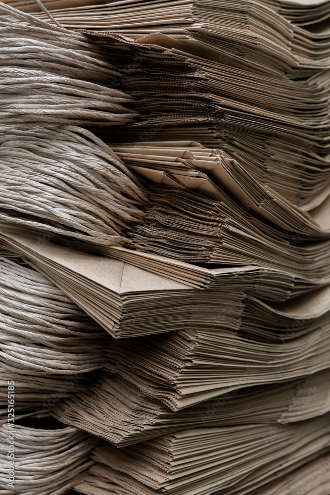 Side View Of Huge Stack of Recycled Paper close up. Business concept. Huge Stack of Recycled Paper envelopes closeup. Side View Of Huge Stack of Recycled Paper close up. Business concept. Huge Stack of Recycled Paper envelopes closeup.