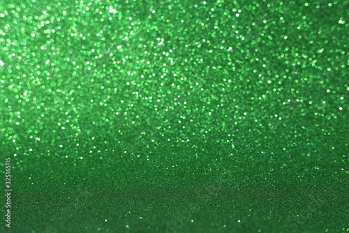 Defocused abstract green lights background. Space. Wallpaper. Abstract glitter bokeh