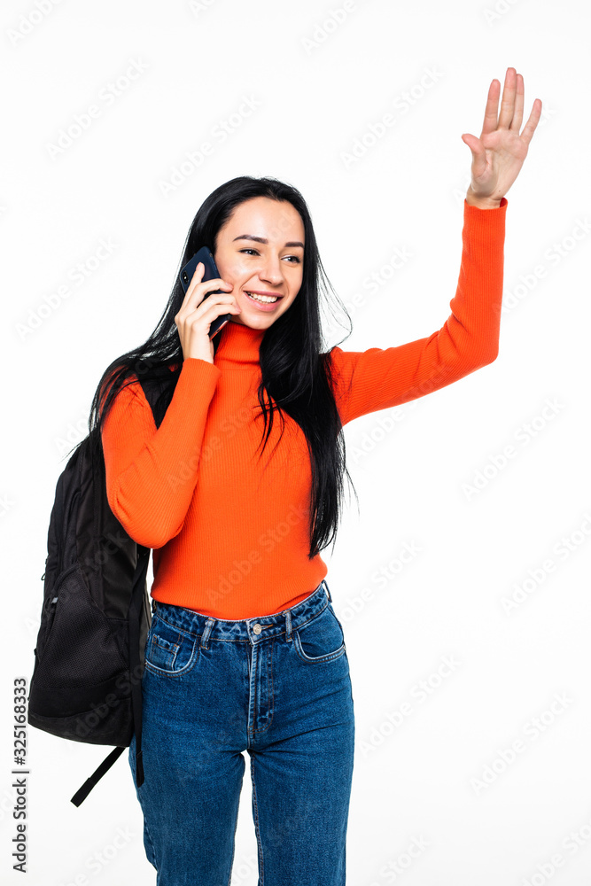 Young student with bag talking phone and wave with hands isolated on white background Young student with bag talking phone and wave with hands isolated on white background