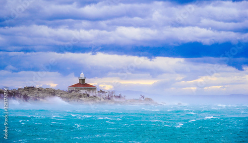 Lighthouse in storm photo